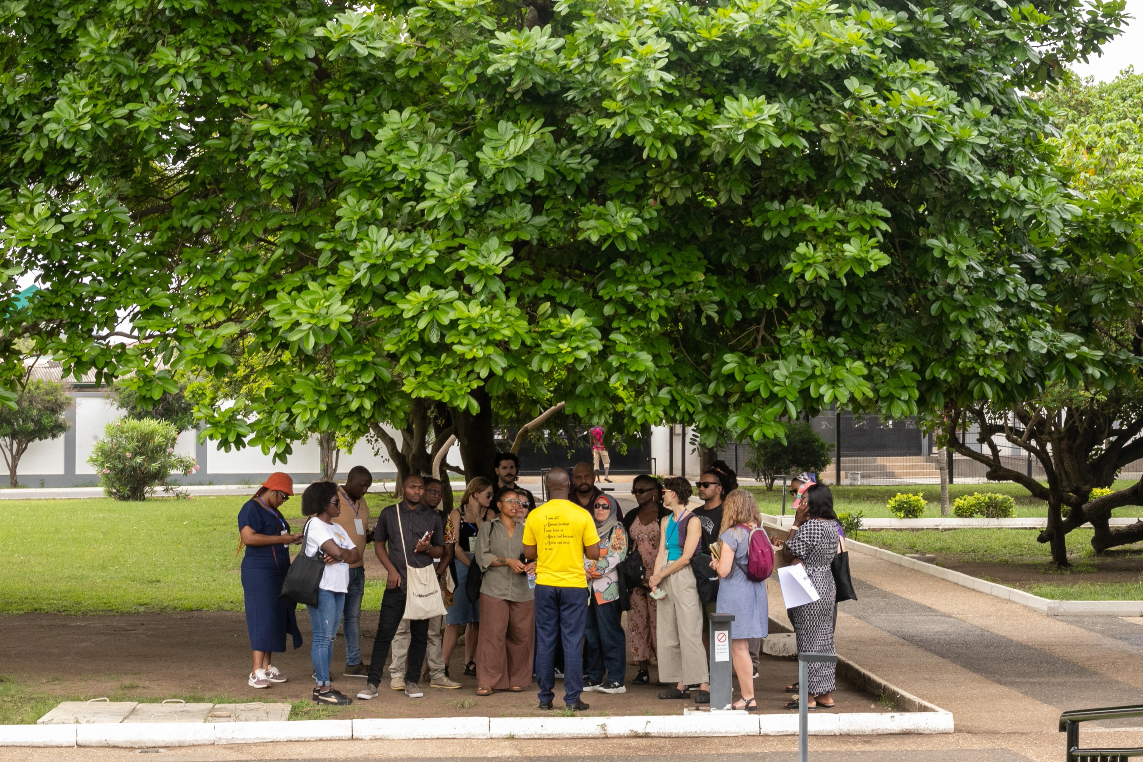group standing under a tree at Kwame Nkrumah Memorial Park