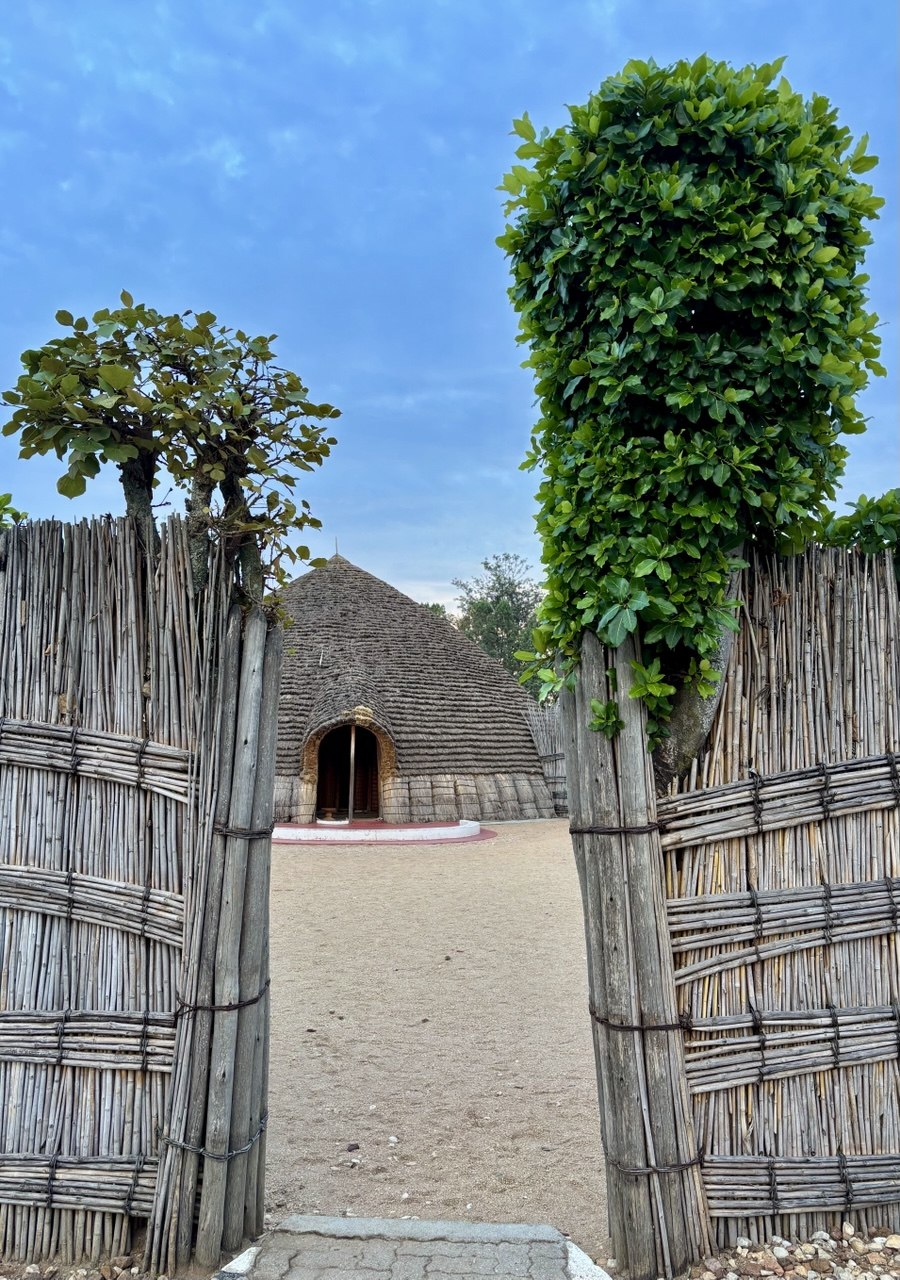 The ficus tree (right) at the entrance to the royal residence, King’s Palace Museum Rukari Nyanza | Photo by Yevheniia Moliar